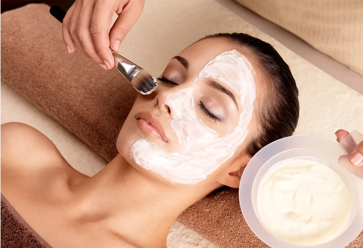 Client receiving DMK Enzyme Therapy facial with enzyme mask