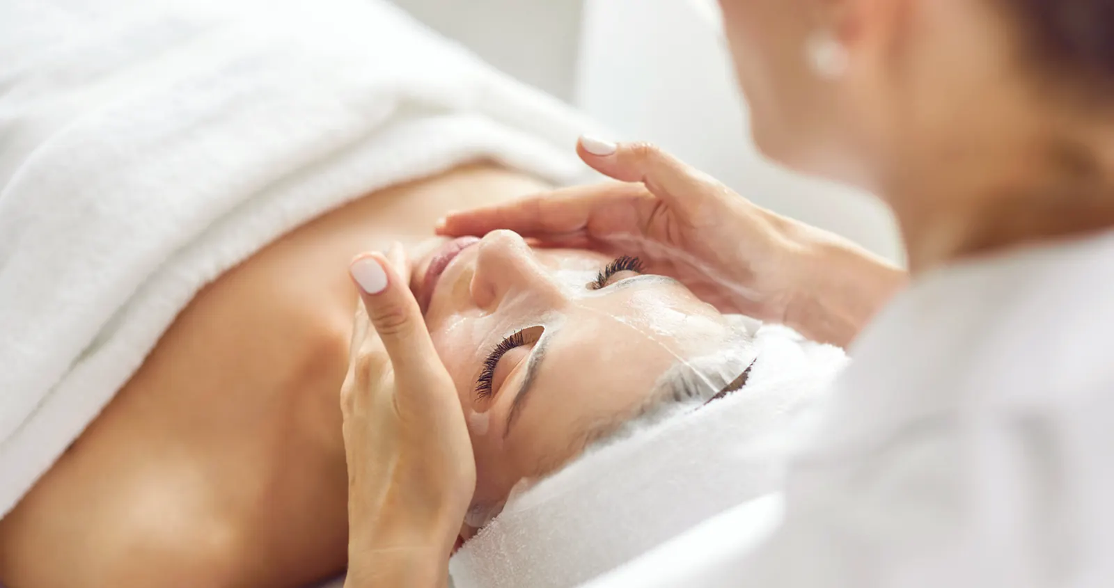 Therapist applying DMK Level 2 muscle banding treatment